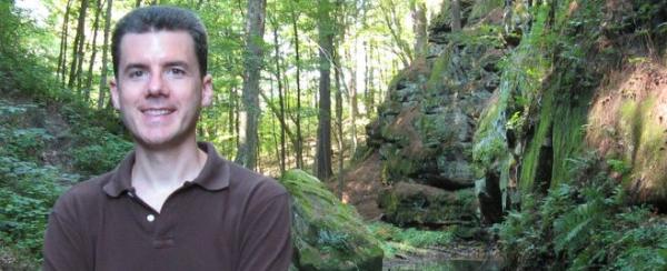 photo of John Hunter with trees in the background