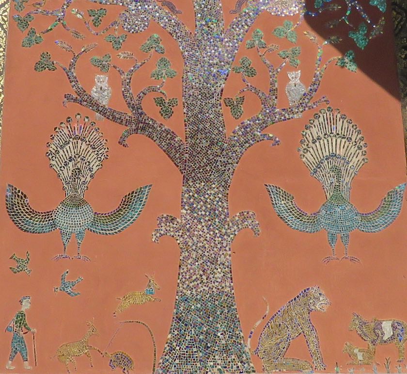 wall mosaic with tree, animals and people