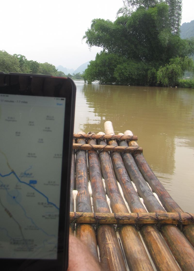 Map app showing gps location while floating on bamboo raft in Yangshuo, China
